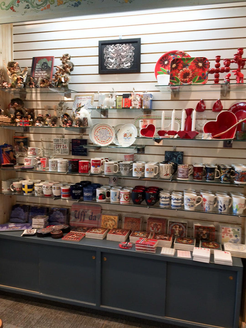 Mugs, trolls, and gifts wall inside Stabo