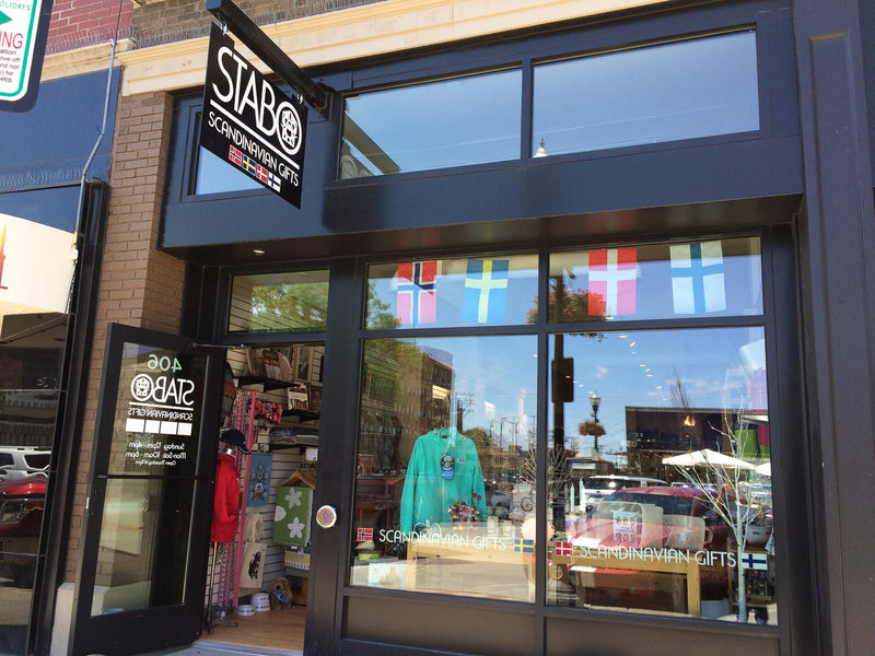 Stabo storefront at 406 Broadway N in downtown Fargo with Nordic flags in the window
